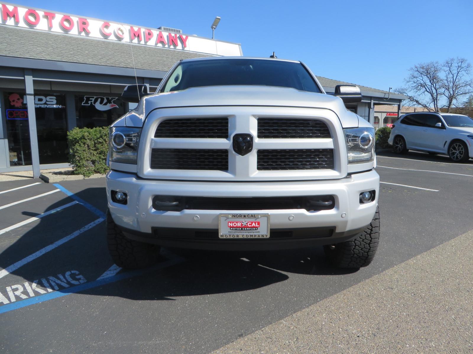 2016 SILVER /BLACK RAM 2500 Laramie Crew Cab SWB 4WD (3C6UR5FL3GG) with an 6.7L L6 OHV 24V TURBO DIESEL engine, 6A transmission, located at 2630 Grass Valley Highway, Auburn, CA, 95603, (530) 508-5100, 38.937893, -121.095482 - Leveled Ram sitting on Fuel Offroad wheels, Falken Wildpeak AT tires, Amp Power steps, Rolling Bed cover, Color matched fender flares, and window tint. - Photo #1